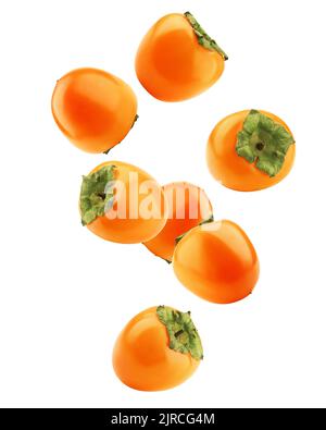Falling persimmon isolated on white background, clipping path, full depth of field Stock Photo
