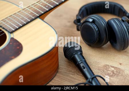 close up of guitar, microphone and headphones Stock Photo
