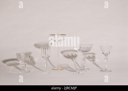 empty glassware, stemware, cocktail glasses on white Stock Photo