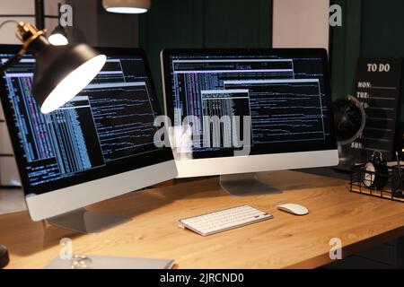 Modern workplace of programmer with computers Stock Photo