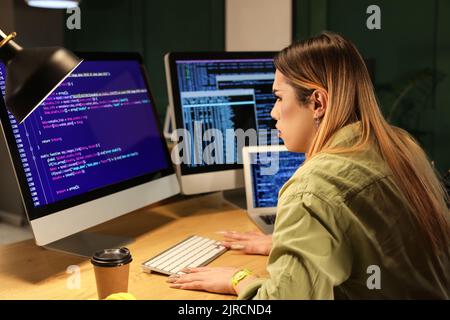 Transgender programmer working in server room Stock Photo