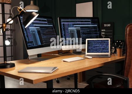 Modern workplace of programmer with computers Stock Photo