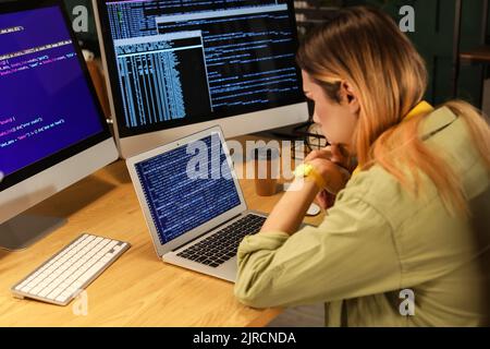 Transgender programmer working in server room Stock Photo