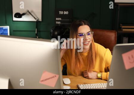 Transgender programmer working in server room Stock Photo