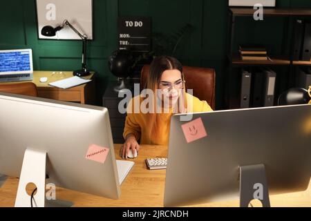 Transgender programmer working in server room Stock Photo