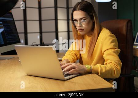 Transgender programmer working in server room Stock Photo