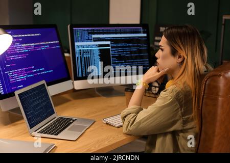 Transgender programmer working in server room Stock Photo