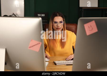 Transgender programmer working in server room Stock Photo