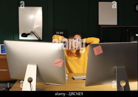 Transgender programmer working in server room Stock Photo