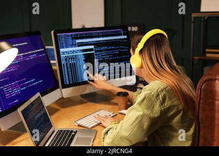 Transgender programmer working in server room Stock Photo