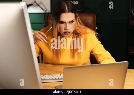 Transgender programmer working in server room Stock Photo