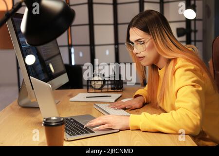 Transgender programmer working in server room Stock Photo