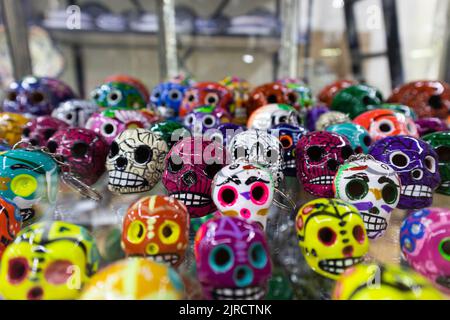 Mexican colorful skulls traditional hispanic ceramic talavera pottery Day of the Dead souvenirs adornments for tourists Stock Photo