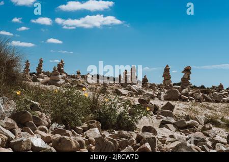 Cairn piles on beach Stock Photo