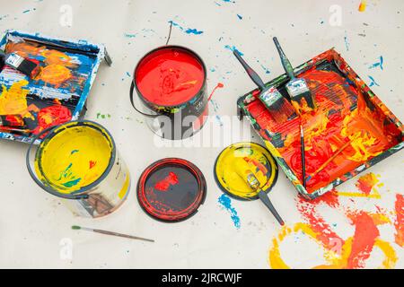 paint cans and brushes in classroom Stock Photo