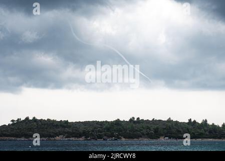 Water Spout typhoon over Halkidiki in greece. Dark stormy clouds. Stock Photo