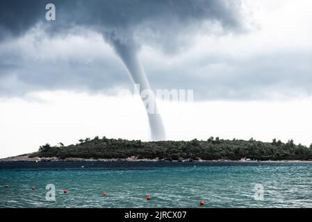 Water Spout typhoon over Halkidiki in greece. Dark stormy clouds. Stock Photo