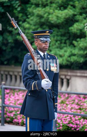 An Honor Guard stands sentinel at the Tomb of the Unknown Soldier in Arlington National Cemetery, Virginia. Stock Photo