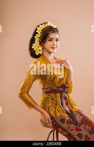 attractive balinese woman wearing traditional kebaya in studio Stock Photo