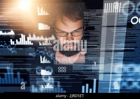 The work of a programmer is never done. a young computer programmer working on source code. Stock Photo