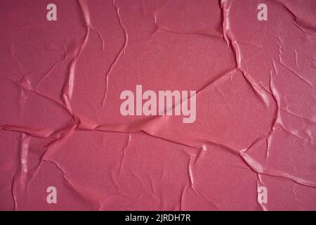 Pink background. Wet and wrinkled sheet of paper. Background mockup. Stock Photo