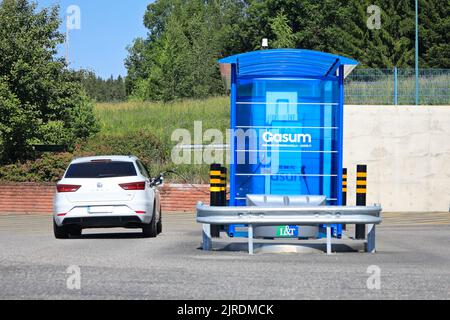 White Seat Leon TGI car being refueled biogas at Gasum CNG station on a sunny day in Salo, Finland. July 17, 2020. Stock Photo