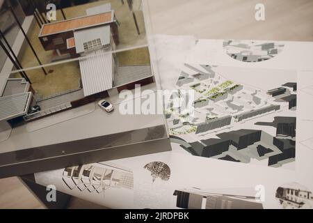 Drawings blueprints and layout building design project at office table. Stock Photo