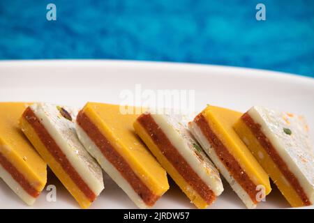 Indian Mithai Kaju Kesar Choco Gulkand Sandwich Burfi Also Known As Kajoo Barfi Is Diamond Shaped Sweet Made Of Cashew Nuts, Chocolate, Saffron, Mawa, Stock Photo