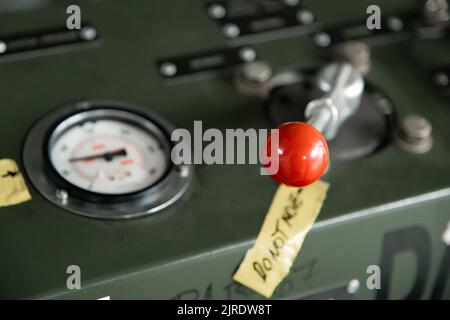 Red knob on control for industrial equipment Stock Photo