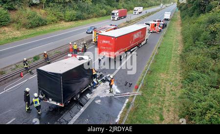 24 August 2022, North Rhine-Westphalia, Ibbenbüren: Emergency services work on a badly damaged truck. A man crashed his van into a truck at the end of a traffic jam on the Autobahn 30 and died in the accident. The exact cause of the rear-end collision between Ibbenbüren and Hörstel (Steinfurt district) was initially unclear, police said Wednesday. (to dpa: 'Man dies in rear-end collision at end of traffic jam') Photo: David Poggemann/Nord-West-Media/dpa Stock Photo