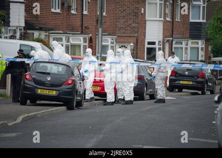 Forensics officers at the scene of an incident at a property in Kingsheath Avenue, Knotty Ash, Liverpool, where nine-year-old Olivia Pratt-Korbel was fatally shot on Monday night. The people of Liverpool have been urged to turn in the masked gunman who killed Olivia as he chased his intended target into her home. Picture date: Wednesday August 24, 2022. Stock Photo