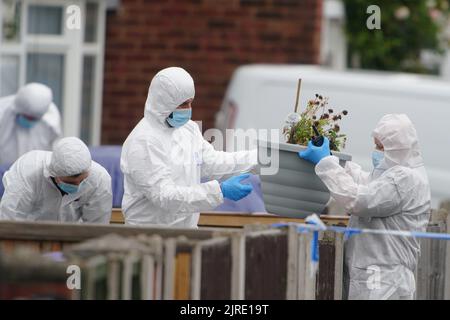 Forensics officers at the scene of an incident at a property in Kingsheath Avenue, Knotty Ash, Liverpool, where nine-year-old Olivia Pratt-Korbel was fatally shot on Monday night. The people of Liverpool have been urged to turn in the masked gunman who killed Olivia as he chased his intended target into her home. Picture date: Wednesday August 24, 2022. Stock Photo