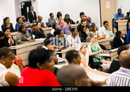 Johannesburg, South Africa - November 20, 2014: Diverse students attending a lecture in College Auditorium Stock Photo