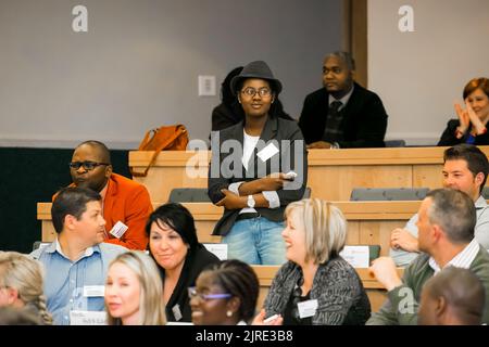 Johannesburg, south Africa - August 31, 2014: Diverse students attending a lecture in College Auditorium Stock Photo