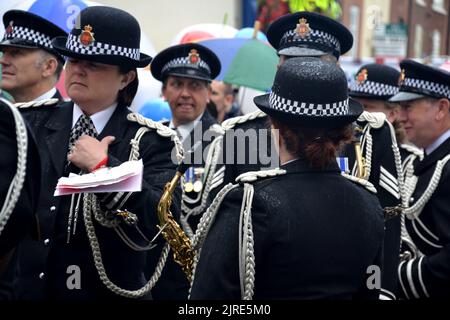 Greater Manchester Police band members in uniform getting ready to play and march on the 2011 Manchester LGBT Pride Parade. Local media have reported that organisers of Manchester LGBTQ+ Pride have asked police officers not to wear their uniforms in the Manchester Pride parade on 27th August, 2022.  Pride organisers said officers hoping to take part should wear 'civilian clothes'. Stock Photo