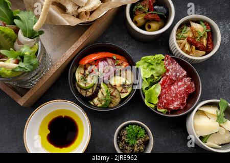 Various appetizers, snacks from vegetables on gray concrete Stock Photo