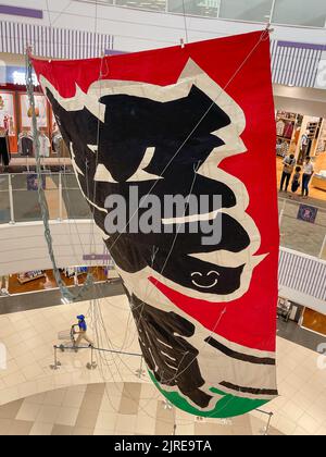 A giant kite flown during the Kasukabe Gian Kite Festival with the city colors hanging from the celling of an AEON Shopping Mall. Stock Photo