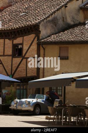 Classic silver Jaguar XK140 car parked in the Plaza de Marques next to the Crooked house restaurant Saldana Saldaña Palencia Castile and Leon Spain Stock Photo