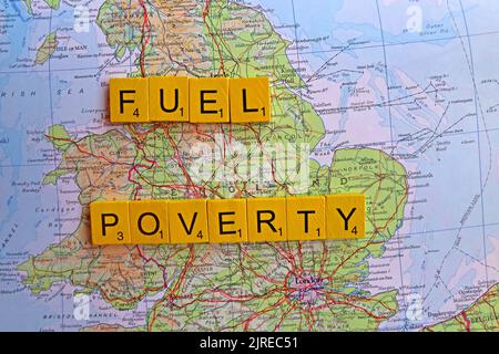 Map showing England, with words Fuel Poverty spelled out. More than half of UK households across Britain will choose to eat or heat Stock Photo