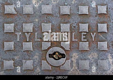 Embossed cast iron street grid, manhole cover, Tyldesley, ironworks, foundry, Manchester, Lancashire, England, UK, M29 8DZ Stock Photo