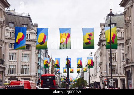 London, UK. 24th August 2022. An art installation featuring flags with the words 'Time for Clean Power' and made from recycled ocean plastic has been installed along Oxford Street to encourage the switch to renewable energy. The installation has been designed by British artist Morag Myerscough, part of a campaign funded by #TOGETHERBAND. Credit: Vuk Valcic/Alamy Live News Stock Photo