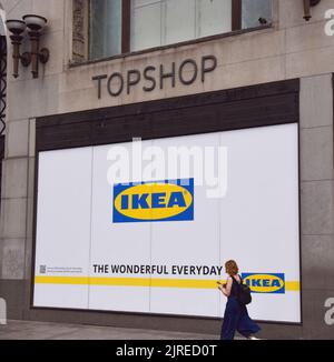 London, UK. 24th August 2022. A woman walks past the shop window of the new IKEA store at the former site of Topshop on Oxford Street, set to open in 2023. Credit: Vuk Valcic/Alamy Live News Stock Photo