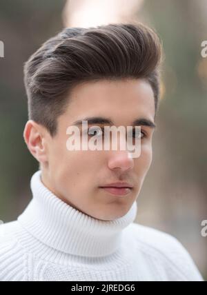 Portrait Of Young Handsome Man Smiling Outdoor. Stock Photo