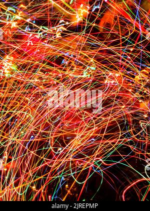 Defocused bokeh bright lights on black background. Bokeh abstract lights on black background. Glitter vintage on black. Stock Photo
