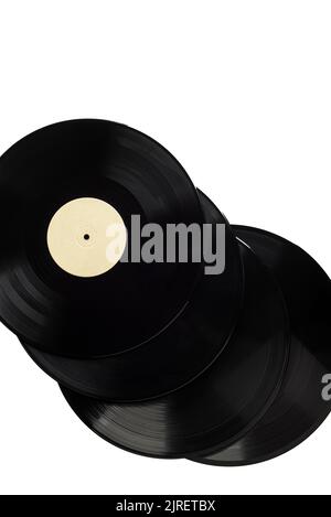 Several vinyl records with a blank label on a white background. Top view of old gramophone records with a label without an inscription. Copy space. Stock Photo