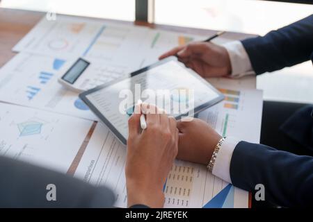 Business people are meeting for analysis data figures to plan business strategies. Business discussing concept Stock Photo
