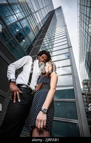 Business Partners. A strong, confident pose from a smartly dressed professional couple in their native corporate environment. From a series of images. Stock Photo