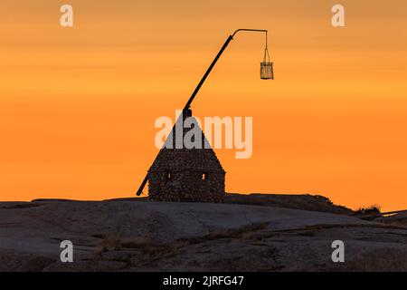Sunset at the end of the world - Vippefyr ancient lighthouse at Verdens Ende in Norway Stock Photo
