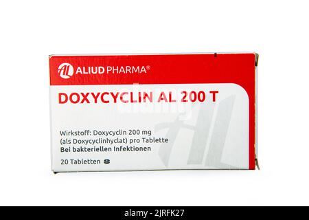 WETZLAR, GERMANY 2022-07-25: Doxycycline antibiotics pills in a cardbox over white background Stock Photo