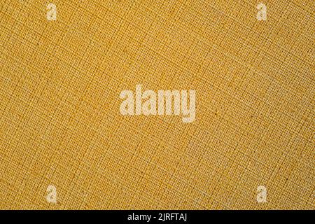Yellow fabric texture background. Abstract yellow textile backdrop. Selective focus. Stock Photo